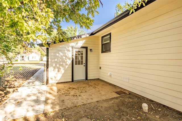 doorway to property featuring a patio area