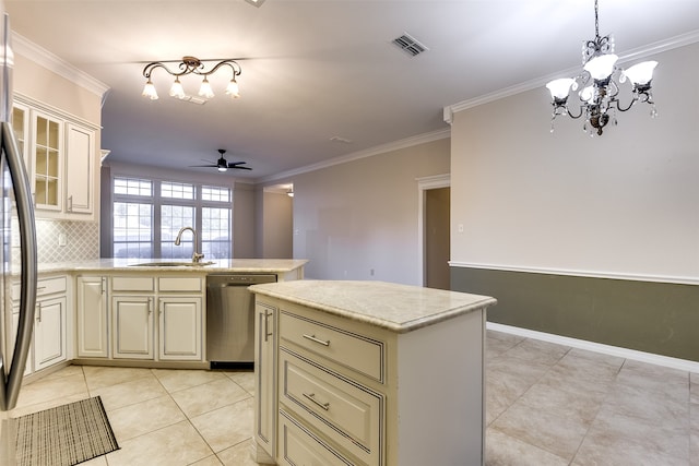 kitchen with ornamental molding, sink, stainless steel dishwasher, a kitchen island, and ceiling fan with notable chandelier