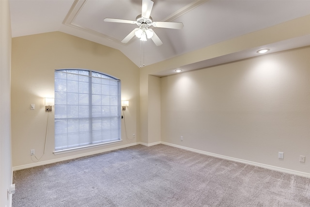 empty room featuring light carpet, lofted ceiling, and ceiling fan