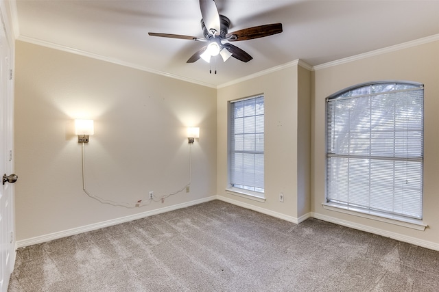 empty room with light carpet, crown molding, and ceiling fan