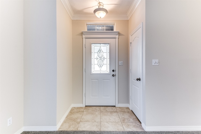 tiled foyer featuring ornamental molding