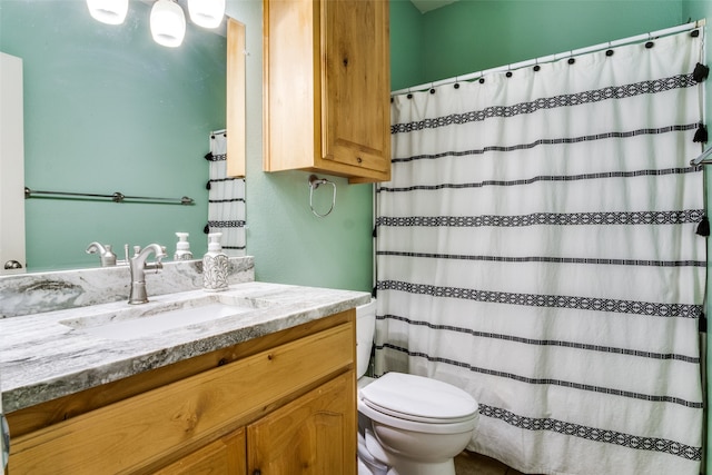 bathroom with vanity, toilet, and a shower with shower curtain