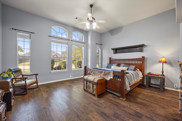 bedroom with ceiling fan and dark hardwood / wood-style flooring