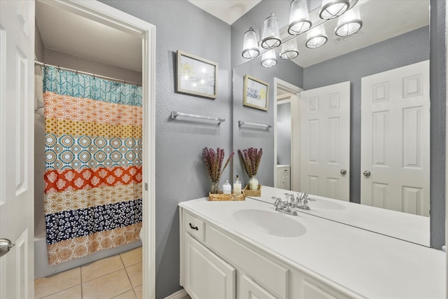 bathroom with vanity and tile patterned flooring