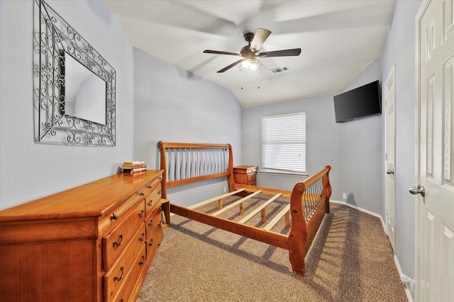 bedroom with carpet floors, vaulted ceiling, and ceiling fan