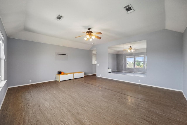 empty room featuring vaulted ceiling, dark hardwood / wood-style flooring, and ceiling fan