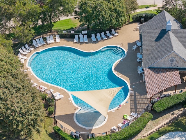 view of swimming pool with a patio