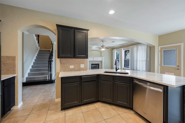 1310 Gold Coast Dr, Rockwall, TX 75087 - kitchen featuring a sink, dishwasher, ceiling fan, and decorative backsplash