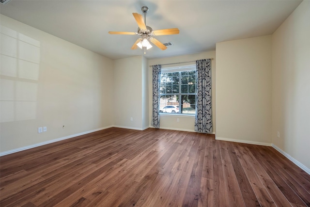 1310 Gold Coast Dr, Rockwall, TX 75087 - empty room featuring dark wood-style floors, baseboards, visible vents, and ceiling fan