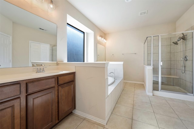 1310 Gold Coast Dr, Rockwall, TX 75087 - full bath featuring tile patterned floors, visible vents, a shower stall, and a garden tub