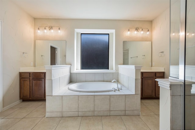 1310 Gold Coast Dr, Rockwall, TX 75087 - bathroom featuring a garden tub, tile patterned flooring, and vanity