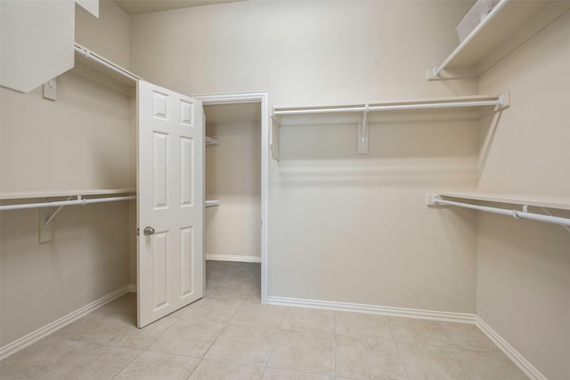 1310 Gold Coast Dr, Rockwall, TX 75087 - spacious closet featuring light tile patterned floors