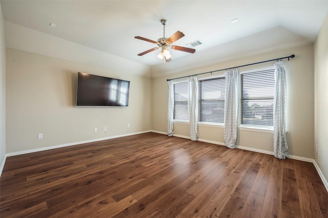 1310 Gold Coast Dr, Rockwall, TX 75087 - empty room featuring visible vents, ceiling fan, dark wood-type flooring, and vaulted ceiling