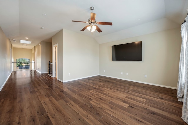 unfurnished living room with dark wood-type flooring, ceiling fan, and vaulted ceiling