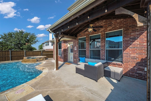 view of swimming pool with an in ground hot tub, an outdoor living space, a patio, and ceiling fan