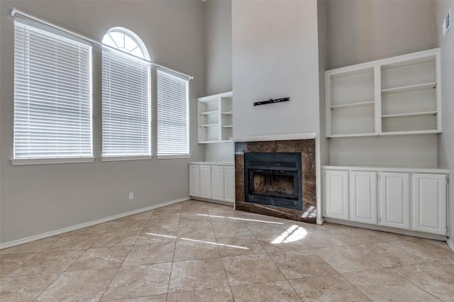 unfurnished living room with light tile patterned floors