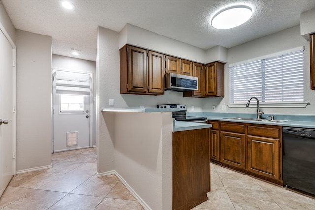 kitchen featuring sink, electric range oven, black dishwasher, a textured ceiling, and light tile patterned floors