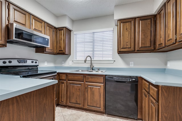 kitchen with a textured ceiling, sink, electric range, black dishwasher, and light tile patterned flooring