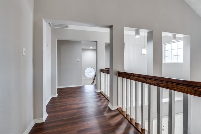 hallway featuring dark wood-type flooring