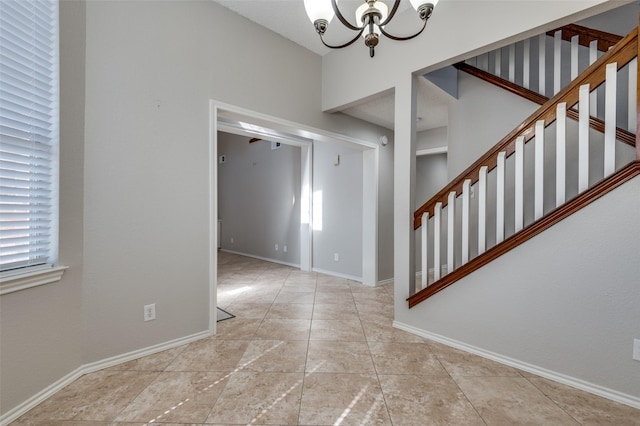 foyer entrance with an inviting chandelier