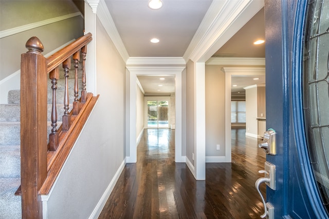 hall with ornamental molding and dark wood-type flooring