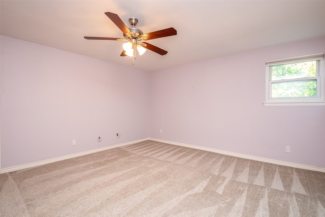 spare room with ceiling fan and carpet flooring