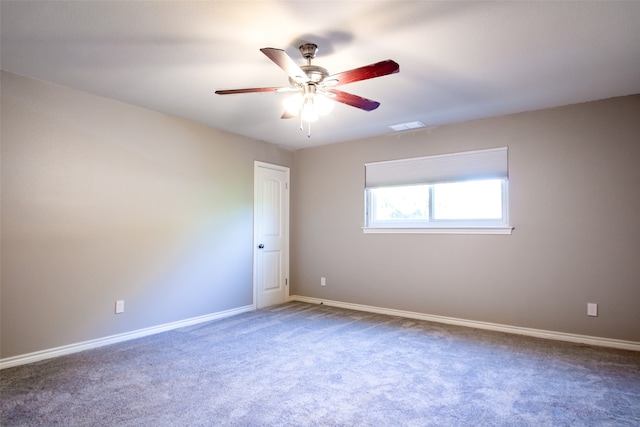 carpeted empty room featuring ceiling fan