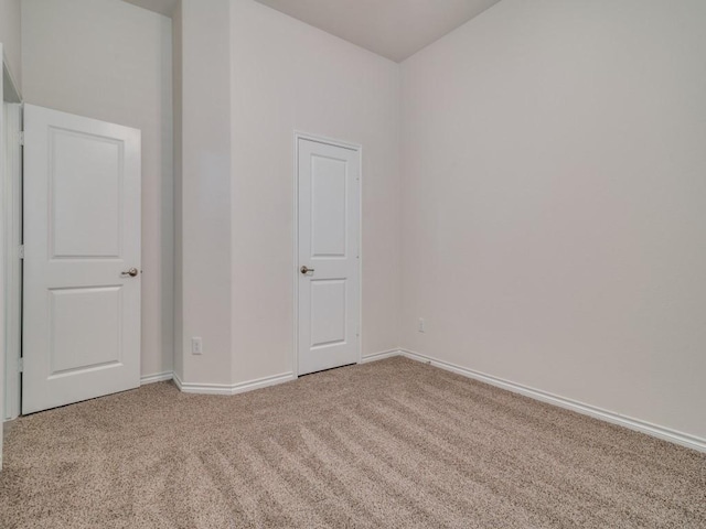 unfurnished room with carpet flooring