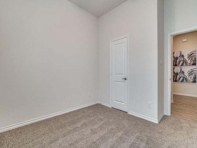 unfurnished room featuring carpet flooring