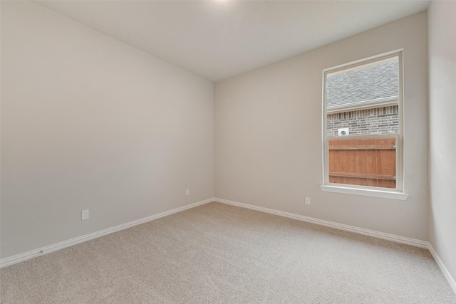 unfurnished room featuring carpet flooring