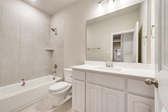 full bathroom with vanity, tile patterned floors, tiled shower / bath combo, and toilet