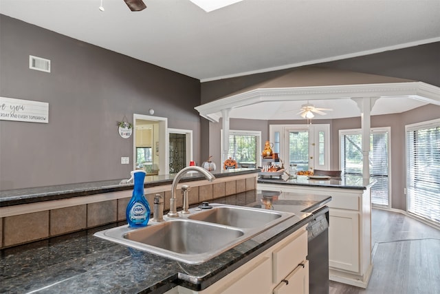 kitchen featuring light hardwood / wood-style floors, ceiling fan, sink, dishwasher, and white cabinetry