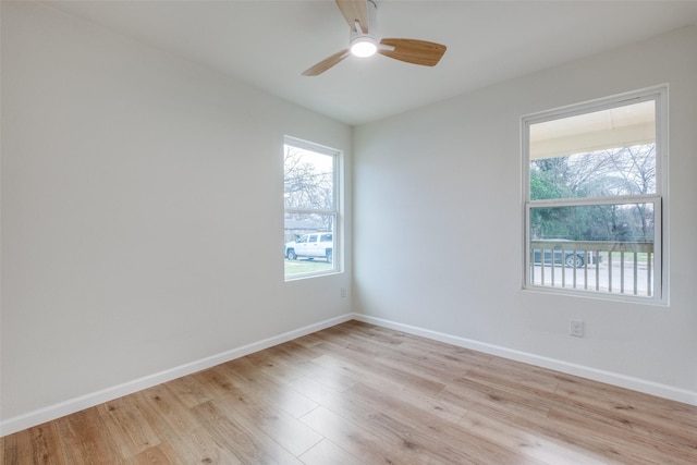 unfurnished room featuring ceiling fan and light wood-type flooring