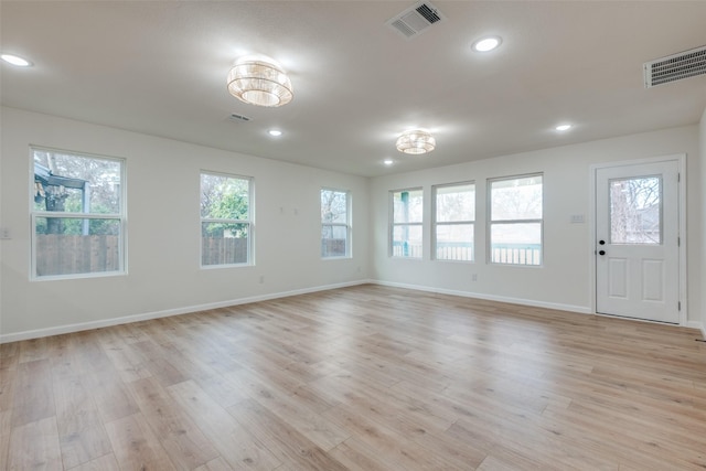 spare room featuring light hardwood / wood-style flooring