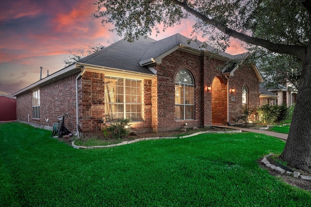 ranch-style house featuring a yard