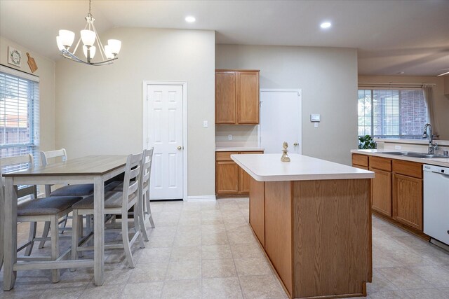 7906 Munich Dr, Rowlett, TX 75089 - kitchen with a sink, white dishwasher, a chandelier, a center island, and light countertops