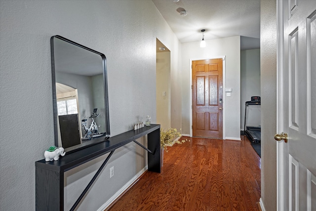 hall with dark hardwood / wood-style floors