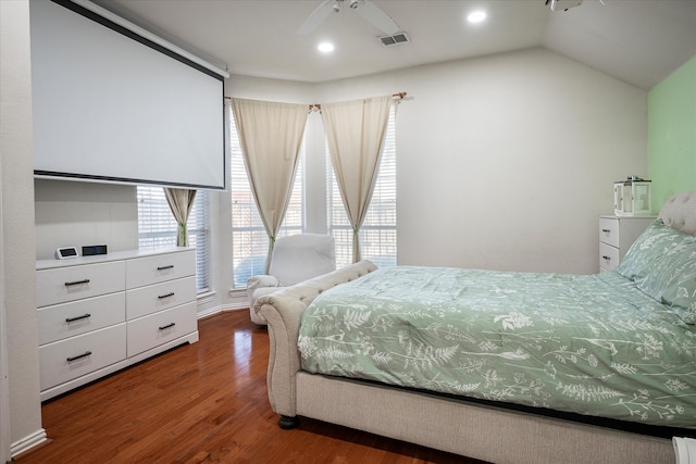 bedroom with lofted ceiling, dark hardwood / wood-style floors, and ceiling fan