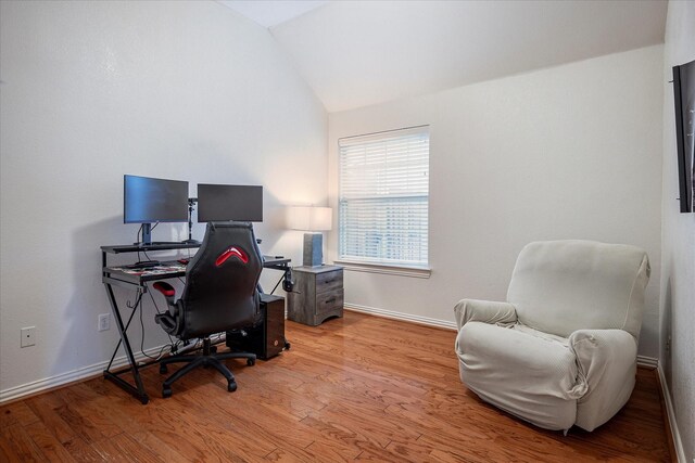 7906 Munich Dr, Rowlett, TX 75089 - home office with lofted ceiling, light wood-type flooring, and baseboards