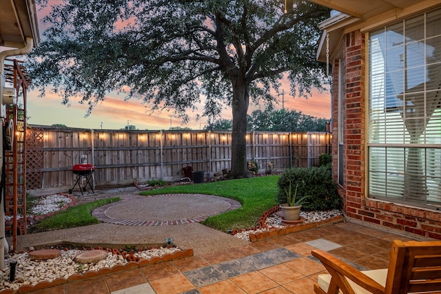 view of patio terrace at dusk