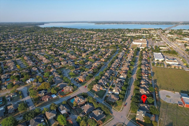 7906 Munich Dr, Rowlett, TX 75089 - aerial overview of property's location with a large body of water and nearby suburban area