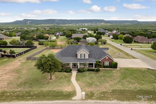 drone / aerial view featuring a mountain view