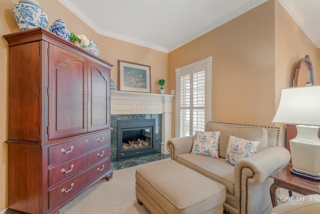 sitting room featuring ornamental molding, a fireplace, and light carpet