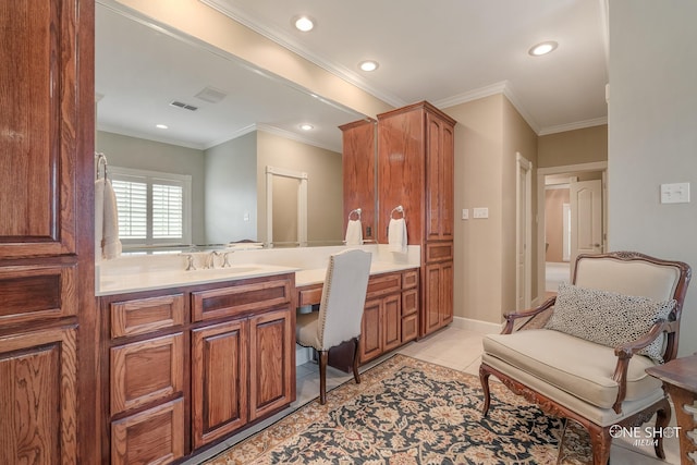 bathroom with vanity, crown molding, and tile patterned floors