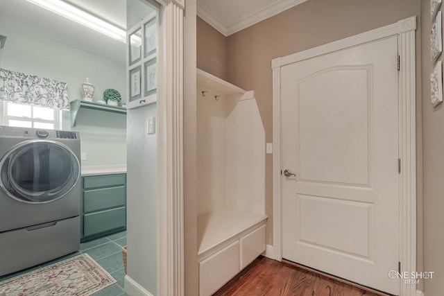 washroom with ornamental molding, dark wood-type flooring, and washer / clothes dryer