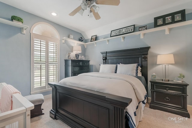 bedroom with light carpet and ceiling fan