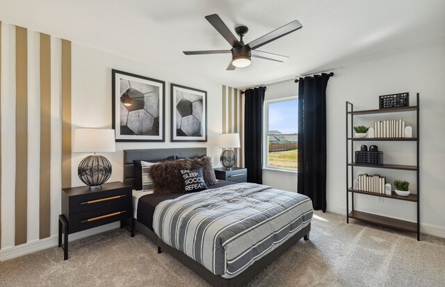 bedroom featuring light carpet and ceiling fan