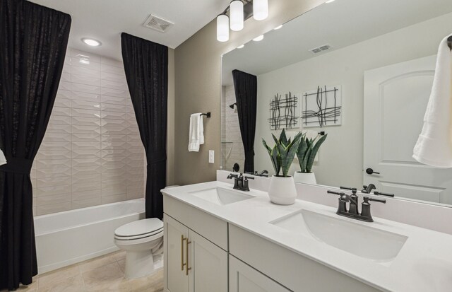 full bathroom featuring shower / tub combo with curtain, tile patterned floors, vanity, and toilet