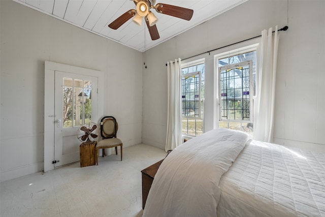 bedroom featuring ceiling fan and multiple windows