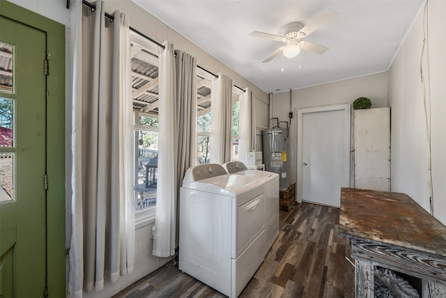 clothes washing area with dark wood-type flooring, ceiling fan, water heater, and washer and clothes dryer